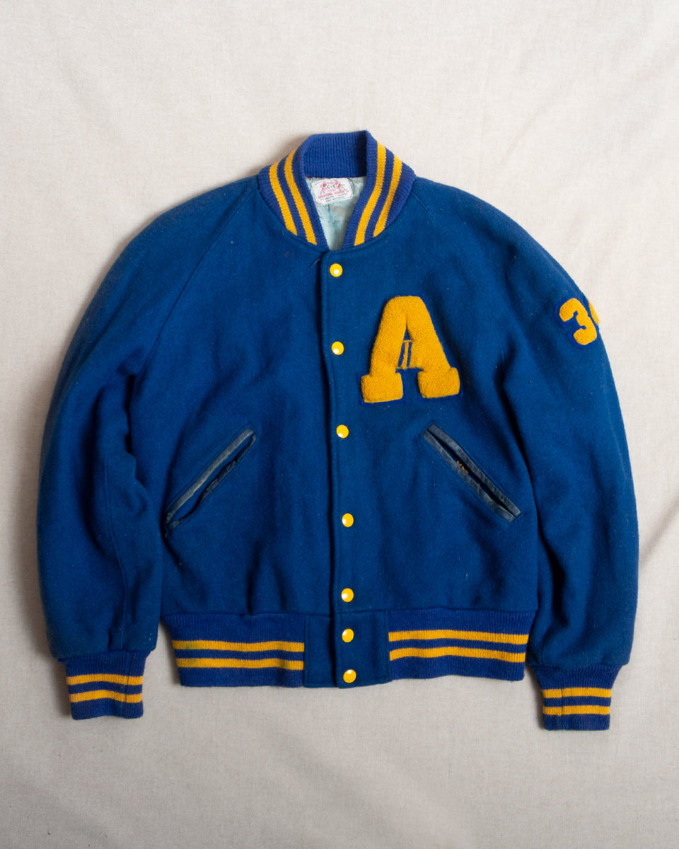 A Blue And Yellow Varsity Jacket (M) Concrete Matter